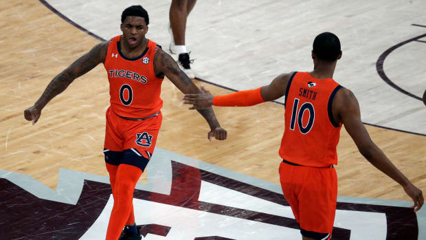 Mar 2, 2022; Starkville, Mississippi, USA; Auburn Tigers guard K.D. Johnson (0) reacts after a basket during the first half again the Mississippi State Bulldogs at Humphrey Coliseum. Mandatory Credit: Petre Thomas-USA TODAY Sports